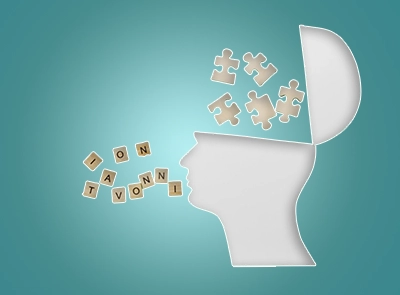 Arte com uma silhueta de uma cabeça, aberta, saindo peças de quebra-cabeças de dentro e falando por peças de jogo de palavras, com cada peça com uma letra, em um fundo de degradê radial verde